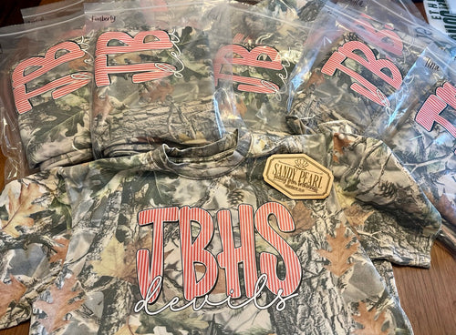 Cotton Collective camo tees with JBHS Devils puff embroidery design, packaged and ready for delivery